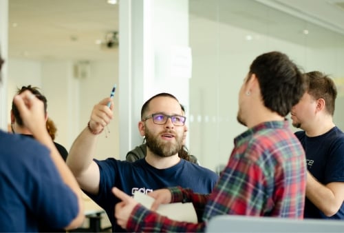 A craftperson talking to another in the Codurance Barcelona office